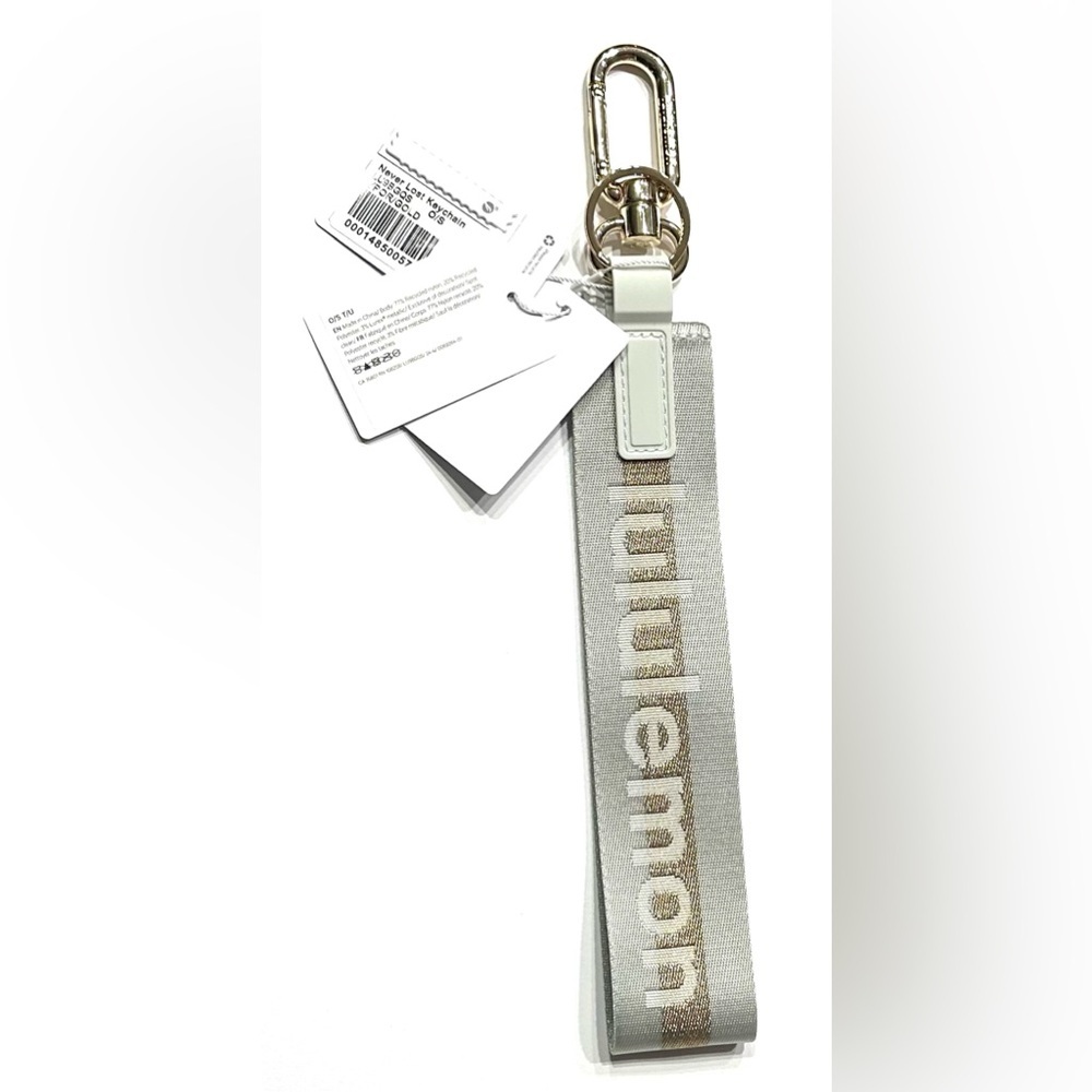 Lululemon Never Lost Keychain Wordmark Vapor Gold, NEW